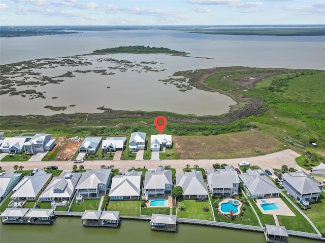 aerial view featuring a water view and a residential view