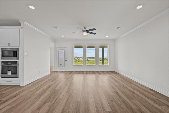 unfurnished living room featuring crown molding, a ceiling fan, and visible vents