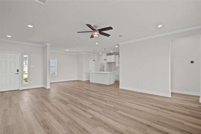 unfurnished living room featuring crown molding, recessed lighting, and ceiling fan