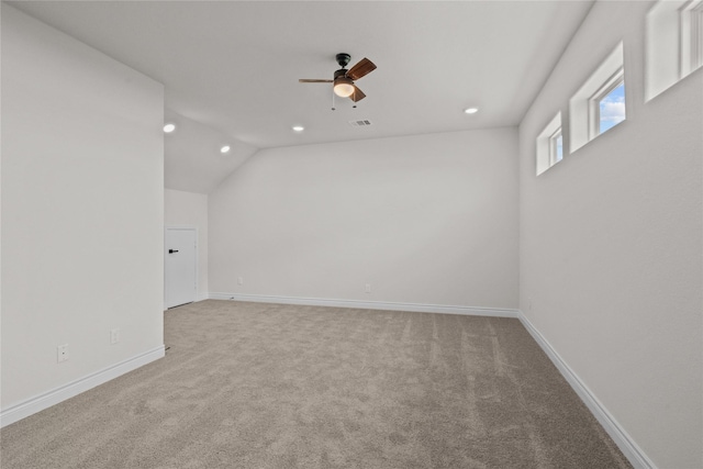 empty room with baseboards, a ceiling fan, recessed lighting, and light colored carpet