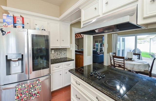kitchen featuring stainless steel fridge with ice dispenser, white cabinets, under cabinet range hood, and black electric stovetop