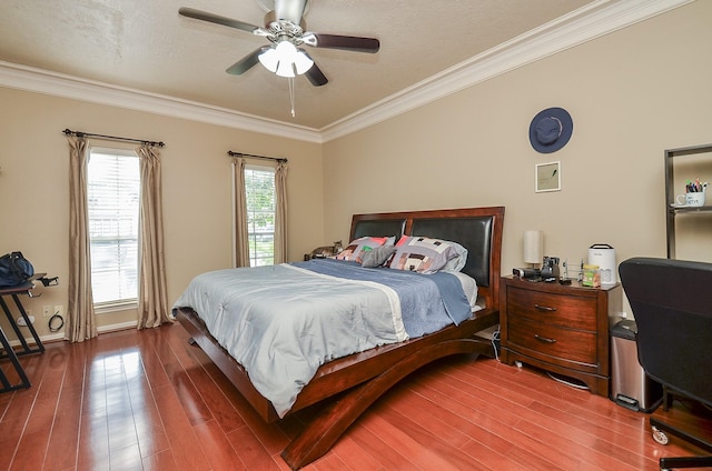 3114 E Ashfield Dr, Houston, TX 77082 - bedroom with crown molding, wood finished floors, a ceiling fan, and baseboards
