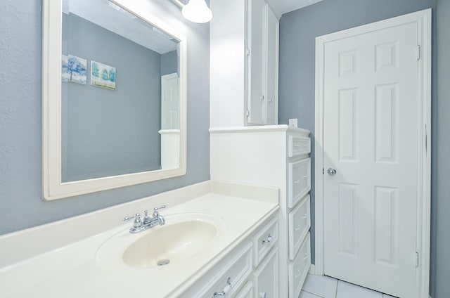 bathroom with vanity and tile patterned flooring