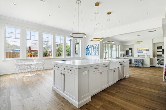 2023 Drexel Dr, Houston, TX 77027 - kitchen with stainless steel dishwasher, a sink, hardwood / wood-style floors, and open floor plan