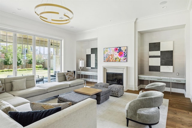 2023 Drexel Dr, Houston, TX 77027 - living room featuring a glass covered fireplace, ornamental molding, and dark wood-style floors