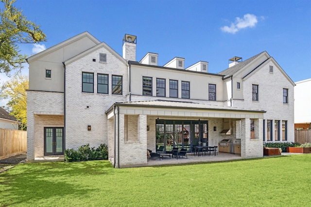 2023 Drexel Dr, Houston, TX 77027 - back of property featuring brick siding, french doors, and fence