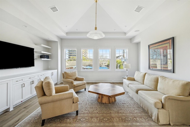 2023 Drexel Dr, Houston, TX 77027 - living room with light wood finished floors, visible vents, and a raised ceiling