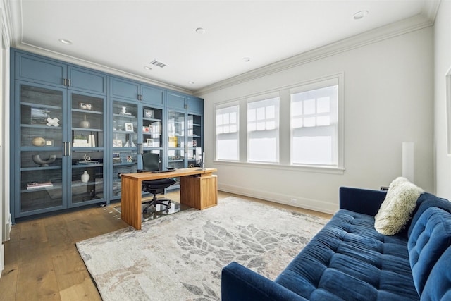2023 Drexel Dr, Houston, TX 77027 - office area featuring baseboards, ornamental molding, and wood finished floors