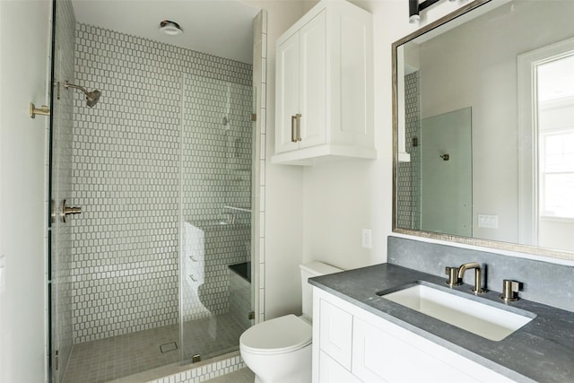 2023 Drexel Dr, Houston, TX 77027 - full bathroom featuring vanity, toilet, and a stall shower