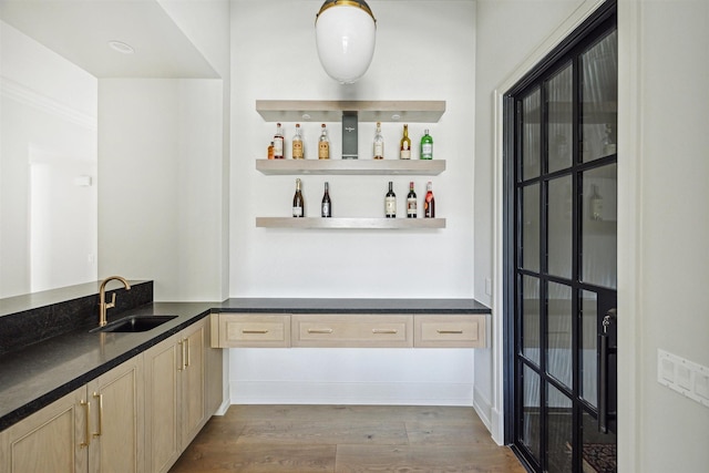 2023 Drexel Dr, Houston, TX 77027 - bar with dark wood finished floors, a sink, and indoor bar