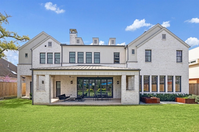 2023 Drexel Dr, Houston, TX 77027 - back of property featuring fence, a standing seam roof, and brick siding