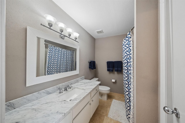 bathroom featuring tile patterned flooring, vanity, toilet, a shower with curtain, and visible vents