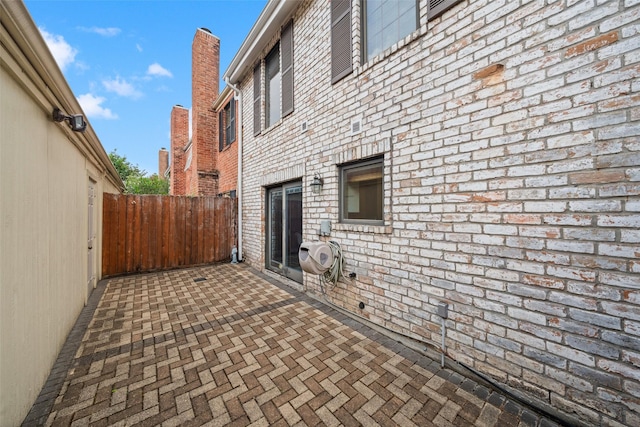view of patio featuring fence
