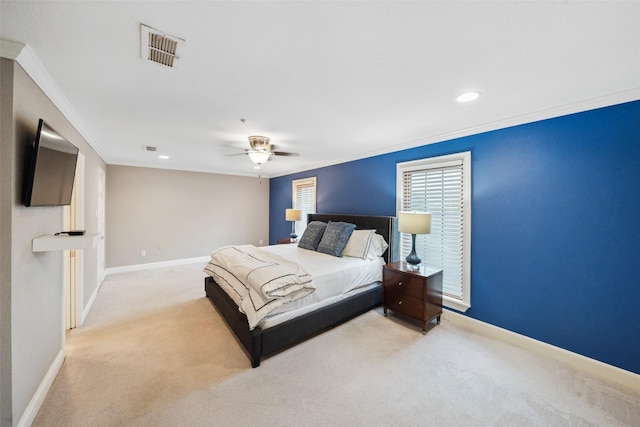 carpeted bedroom with baseboards, visible vents, and ornamental molding