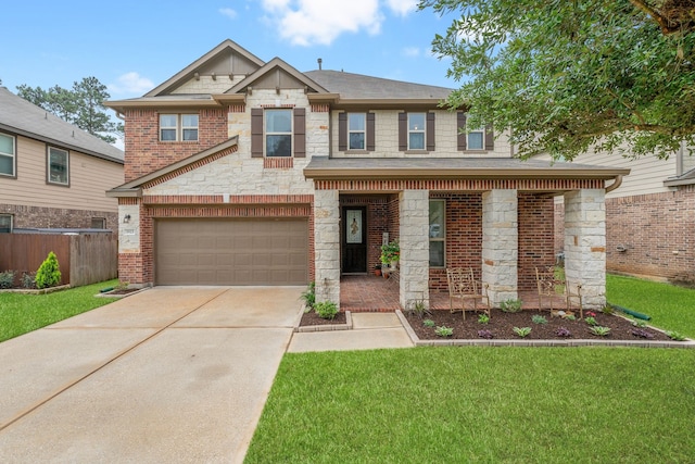 view of front of house with concrete driveway, a front lawn, stone siding, and a garage