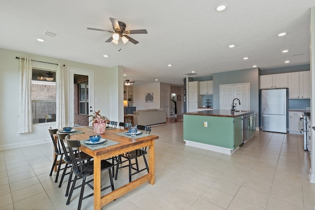 dining area featuring ceiling fan, recessed lighting, baseboards, light tile patterned floors, and visible vents
