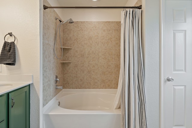 full bathroom featuring vanity, a textured wall, and shower / bath combination with curtain