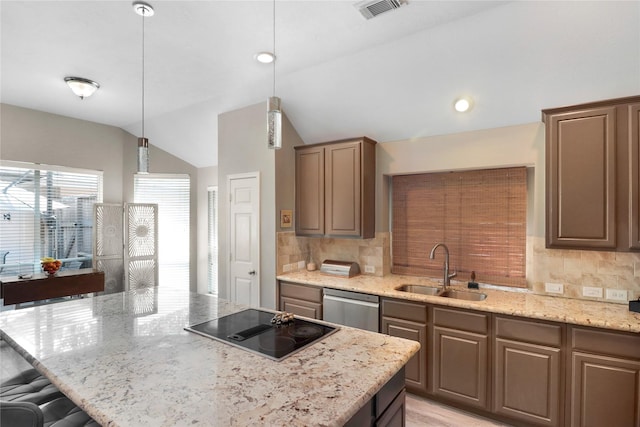 kitchen featuring a sink, black electric stovetop, visible vents, stainless steel dishwasher, and lofted ceiling