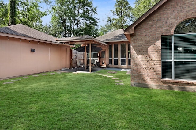 view of yard featuring a patio and fence