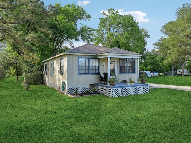 bungalow-style home with a front lawn