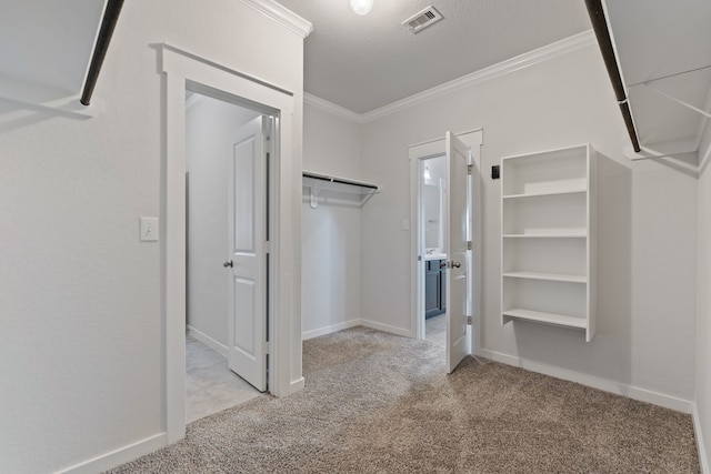 walk in closet with carpet flooring and visible vents