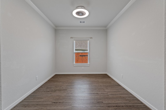 unfurnished room featuring crown molding, baseboards, visible vents, and dark wood-type flooring