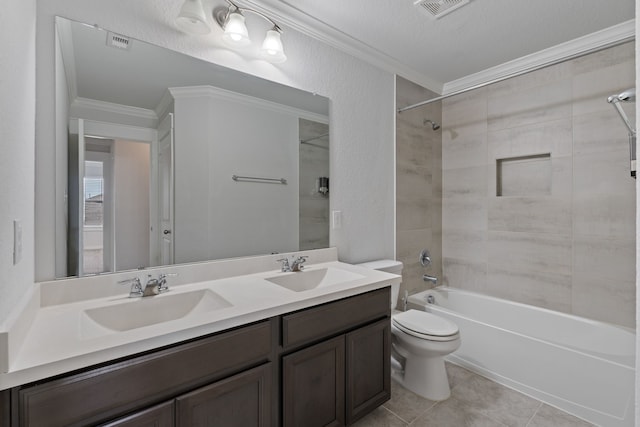 bathroom with a sink, crown molding, and toilet