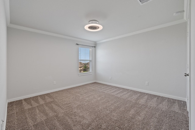 carpeted empty room with crown molding and baseboards