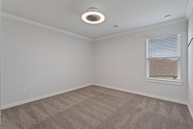 unfurnished room featuring crown molding, baseboards, visible vents, and carpet