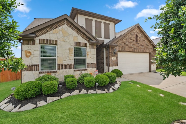 view of front facade with driveway, a front lawn, stone siding, and a garage