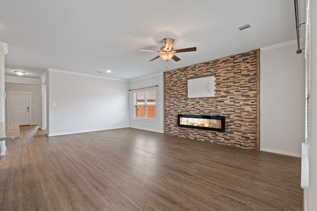 unfurnished living room with crown molding, a ceiling fan, wood finished floors, and visible vents