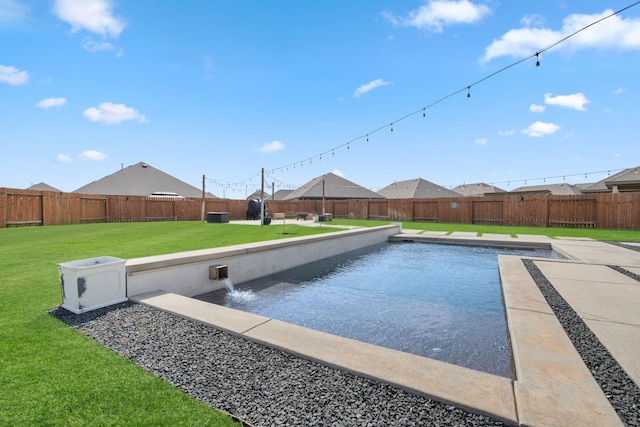 view of swimming pool featuring a fenced in pool, a fenced backyard, and a yard