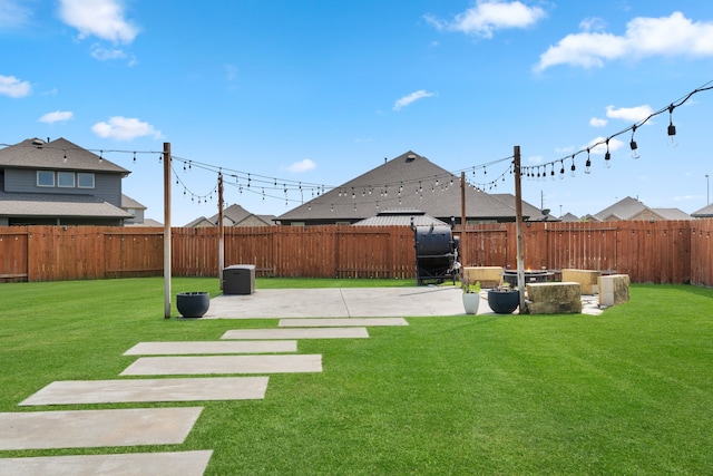 view of yard with a fenced backyard and a patio