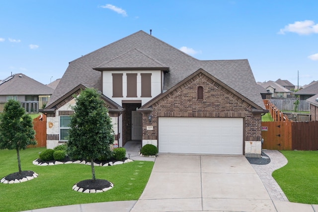 view of front facade with roof with shingles, brick siding, fence, concrete driveway, and an attached garage