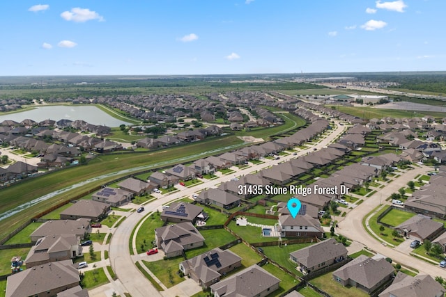 bird's eye view featuring a residential view and a water view
