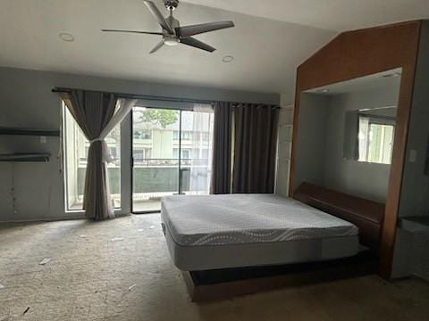 carpeted bedroom with access to exterior, ceiling fan, and lofted ceiling