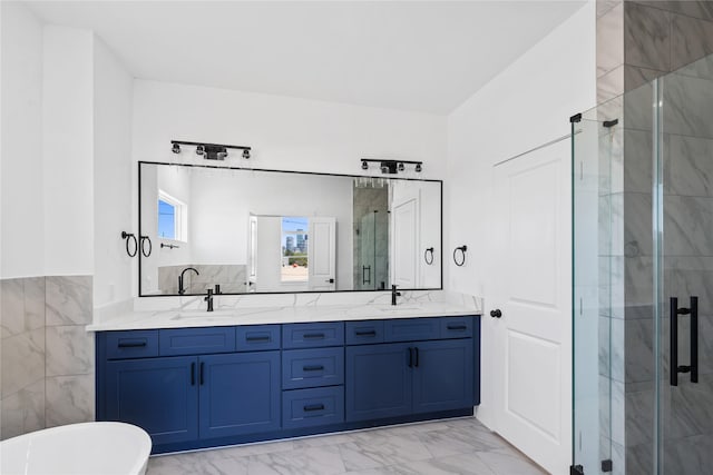 bathroom with a sink, double vanity, a stall shower, a freestanding tub, and marble finish floor