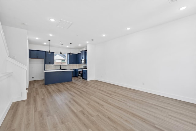 unfurnished living room featuring baseboards, recessed lighting, visible vents, and light wood-style flooring