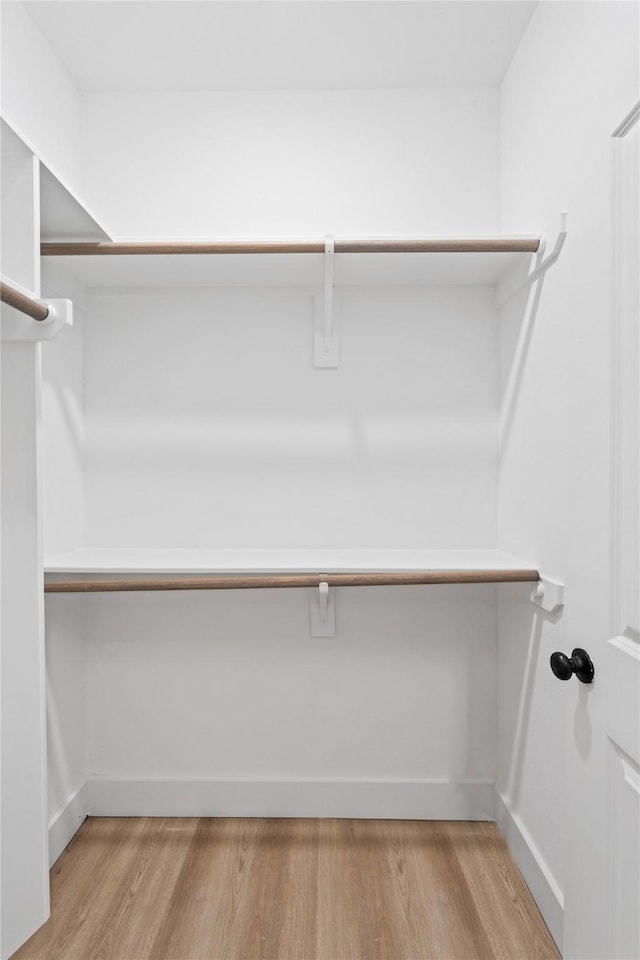 walk in closet featuring light wood-type flooring