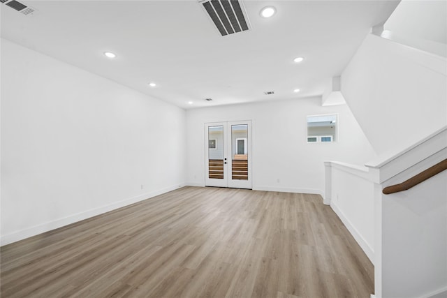 interior space with baseboards, visible vents, light wood-type flooring, and recessed lighting
