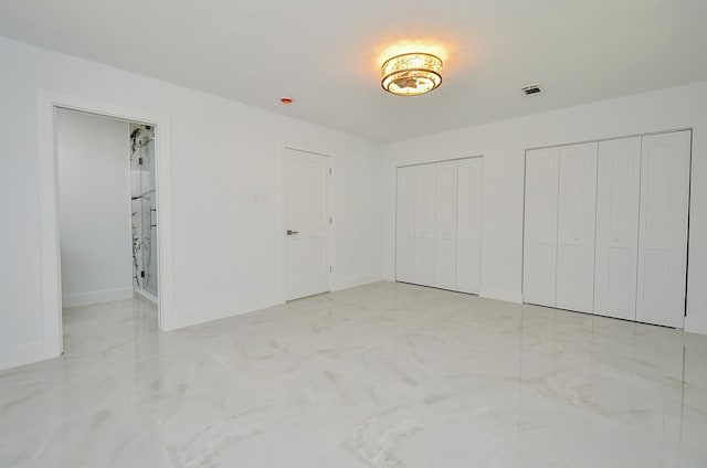 6107 Kuldell Dr, Houston, TX 77074 - unfurnished bedroom featuring two closets and baseboards