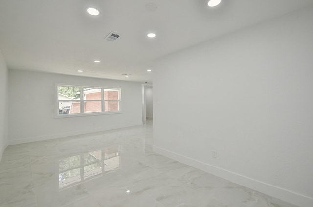 6107 Kuldell Dr, Houston, TX 77074 - spare room with recessed lighting and light marble finish flooring