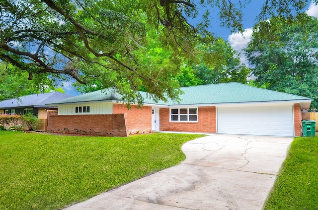 6107 Kuldell Dr, Houston, TX 77074 - ranch-style home featuring brick siding, an attached garage, concrete driveway, and a front lawn