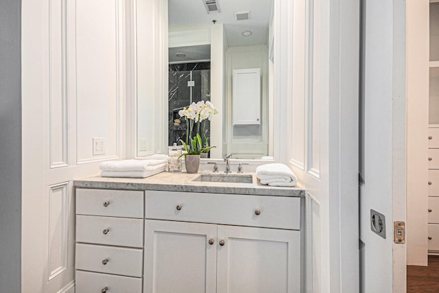 bathroom with visible vents and vanity