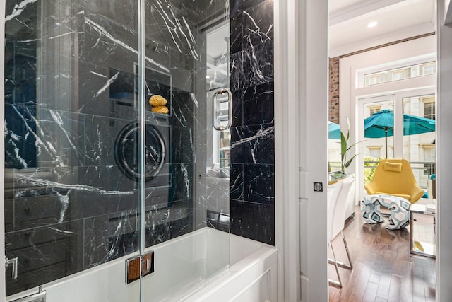 full bathroom with recessed lighting, wood finished floors, an enclosed shower, and a bath