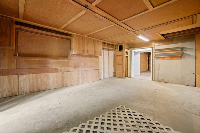 9231 Rockcliff Dr, Houston, TX 77037 - interior space featuring unfinished concrete floors and wood walls