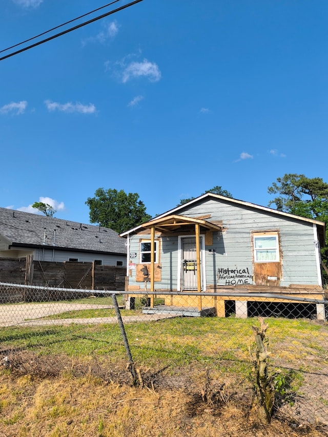 property in mid-construction featuring fence private yard and a front lawn