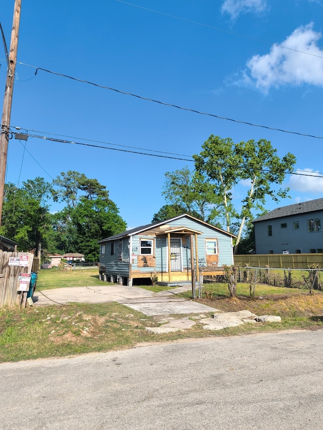 bungalow with a fenced front yard