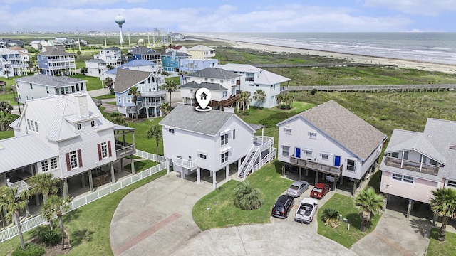 birds eye view of property with a residential view, a view of the beach, and a water view