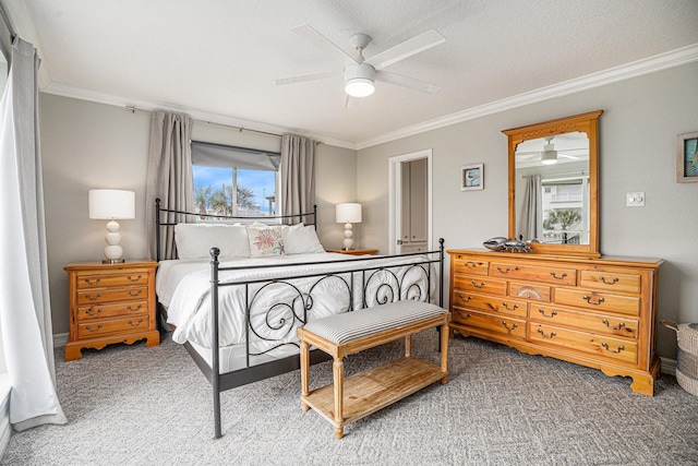 bedroom with crown molding, a ceiling fan, and carpet floors